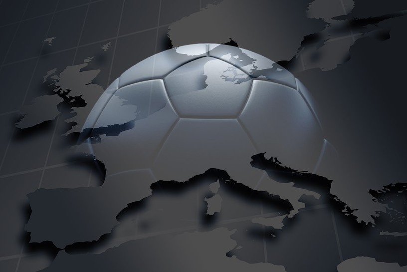 Football in Shadows Against Map of Europe