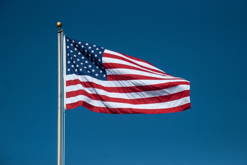 USA Flag Against Clear Blue Sky