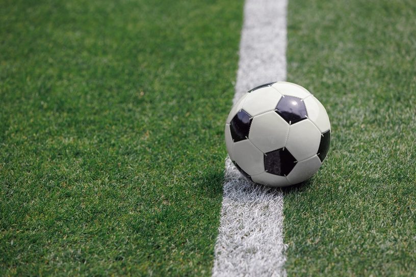 Football on Painted Pitch Line