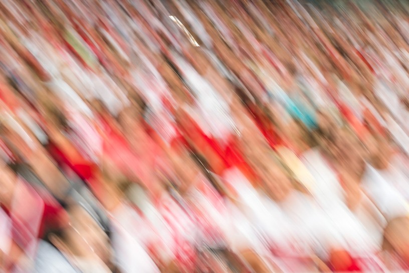 Blurred Football Fans Wearing Red and White
