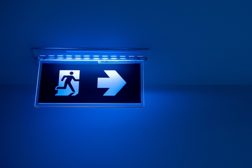 Exit Sign with Blue Light on Ceiling