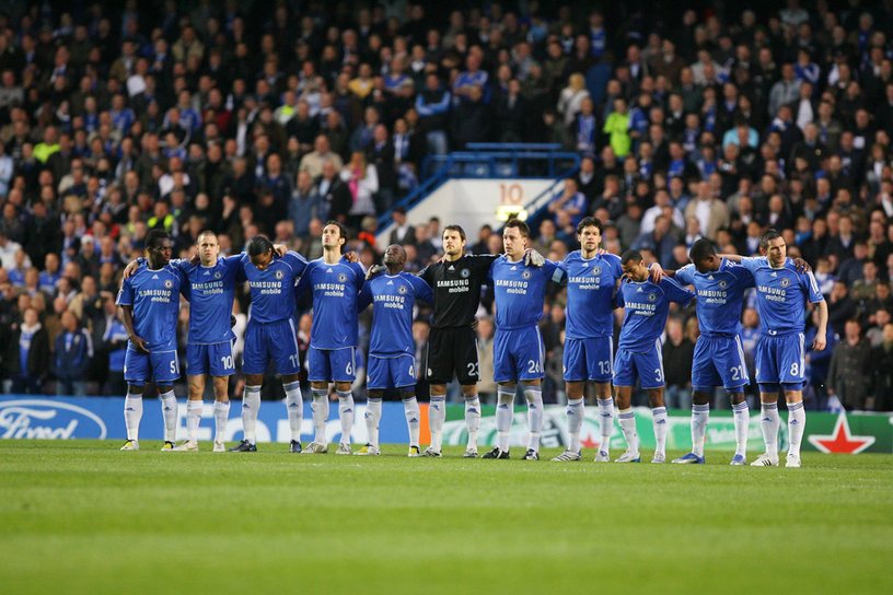Chelsea Players Standing Together on Pitch