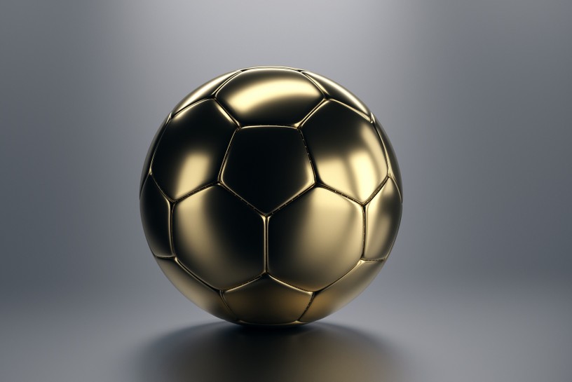 Gold Football Against Grey Background